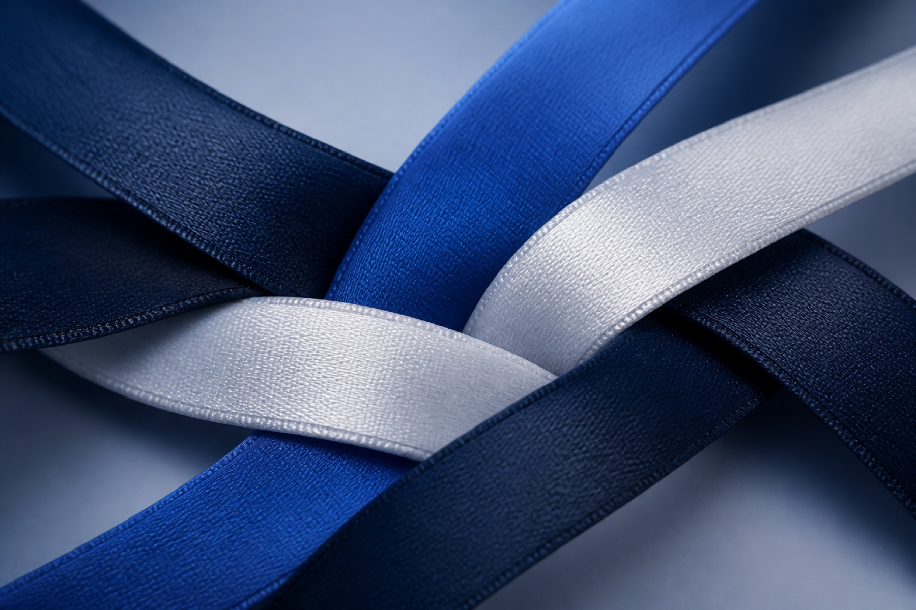 Indigo and silver strands woven together under raking light